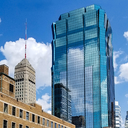 Downtown Minneapolis with a large blue building in the background.